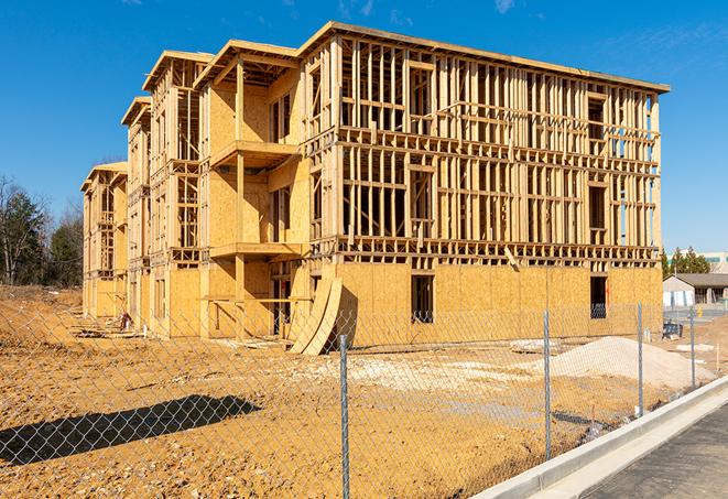 a temporary chain link fence in front of a building under construction, ensuring public safety in Arroyo Grande CA